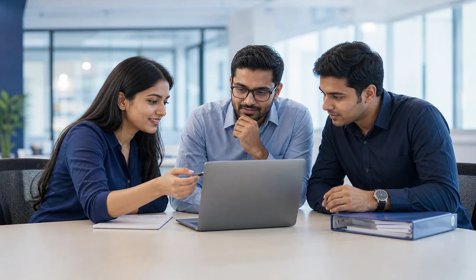 An anonymous customer-success team reviewing a workflow together